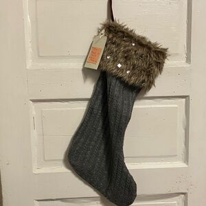 Brand new. Hand knit jumbo 24” stocking in dark grey n brown faux fur with